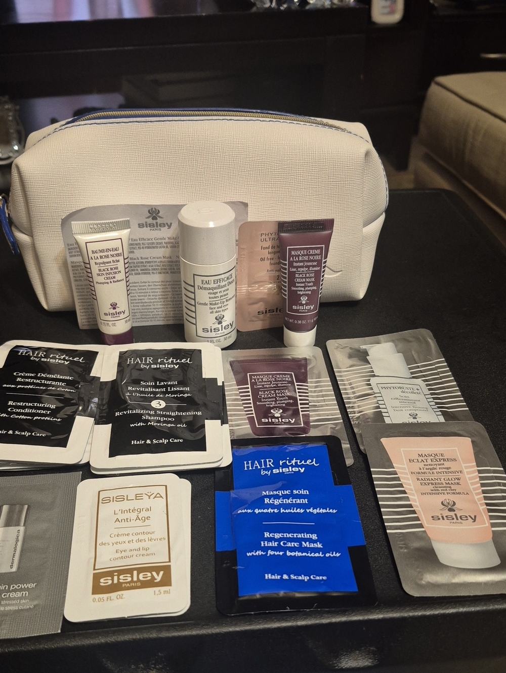 Sisley Travel Skincare Set with Creamy White Cosmetic Pouch and Assorted Sachets